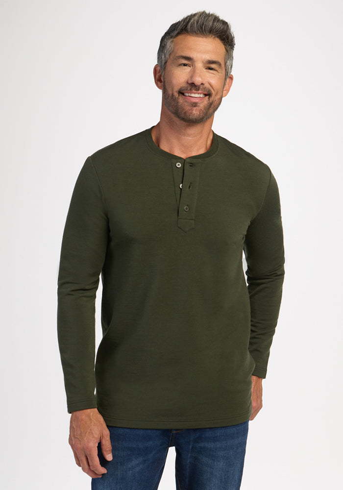 Man in Woolx Jackson Henley - Duffel Bag and jeans, smiling against a plain white background. 