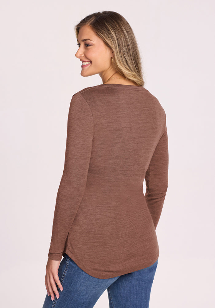 Woman in the Woolx Eva Tunic - Sable Heather with blue jeans, smiling and facing slightly away from the camera.