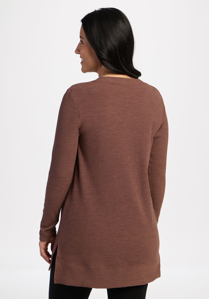 Woman wearing the Woolx Evie Ribbed Tunic in Sable Heather, standing with her back to the camera.