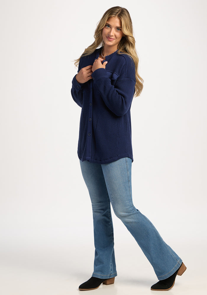 Woman wears the Woolx Oaklynn Waffle Shacket in Ocean Cavern and jeans, posing against a plain white background.