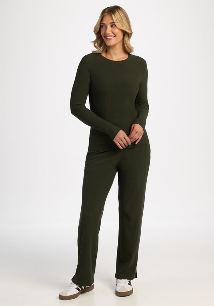 Woman in the Woolx Hadley Petite Crew in Duffel Bag smiles while standing against a plain white background.