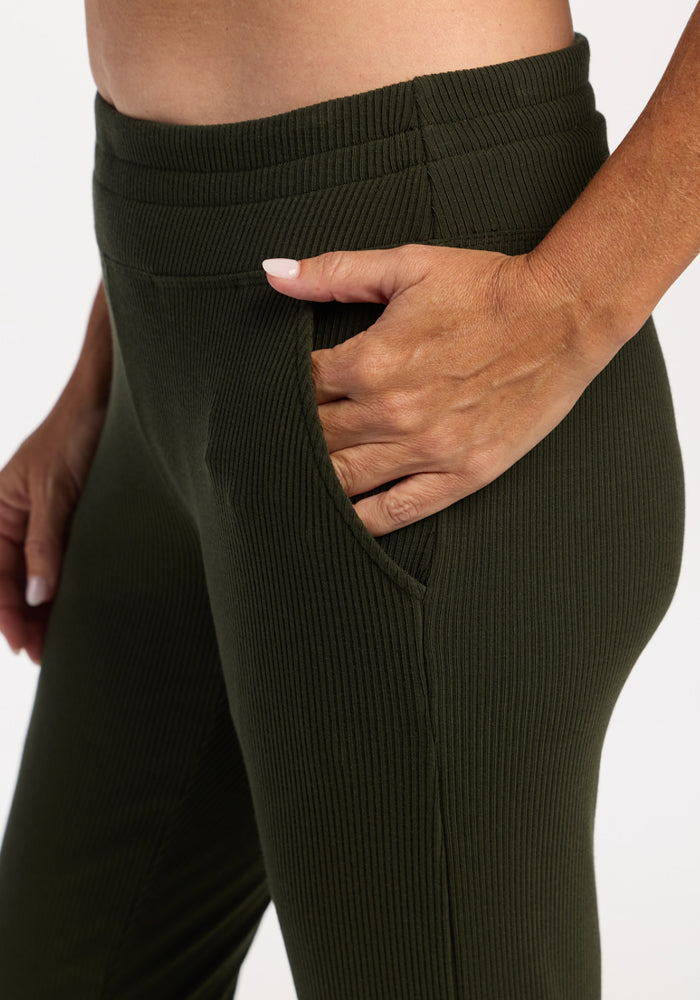Model wears Woolx Lennon Ribbed Joggers - Duffel Bag, hand in pocket, shown waist to mid-thigh.