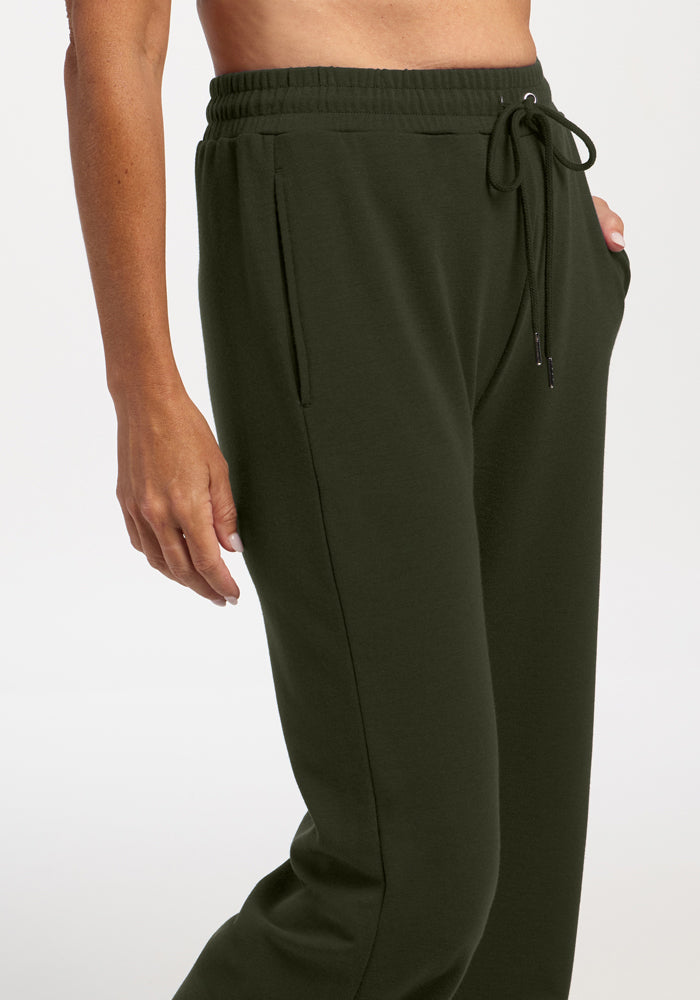 Model wears Woolx Eloise Wide Leg Pants in Duffel Bag, relaxed fit, hands at sides, shown waist to mid-thigh.