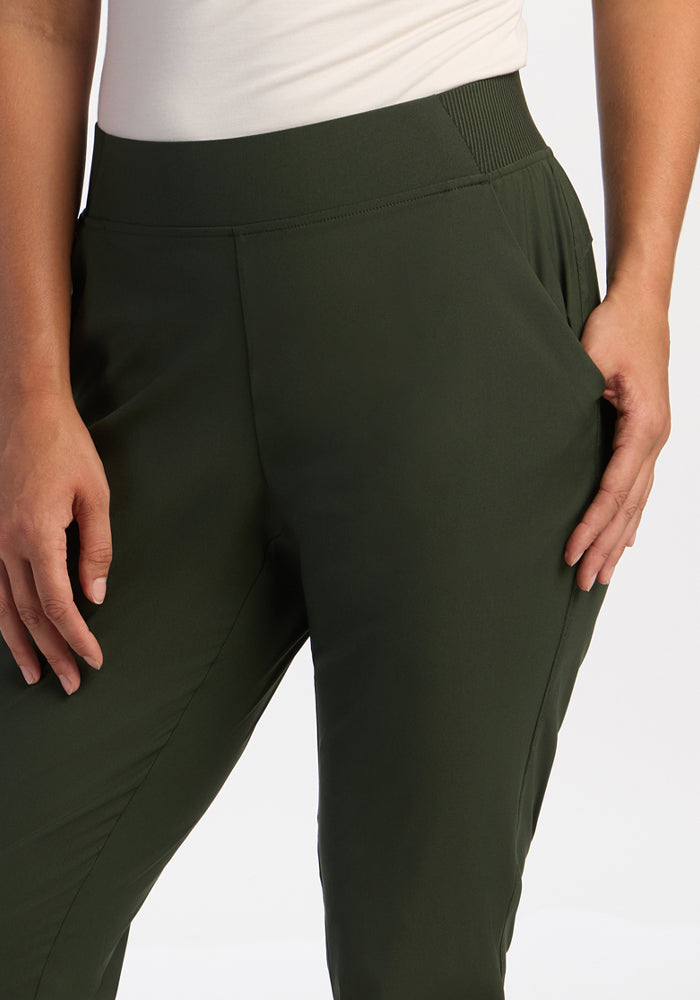 Model in Woolx Palmer Joggers - Duffel Bag, hands in pockets, shown waist to mid-thigh on a plain background.