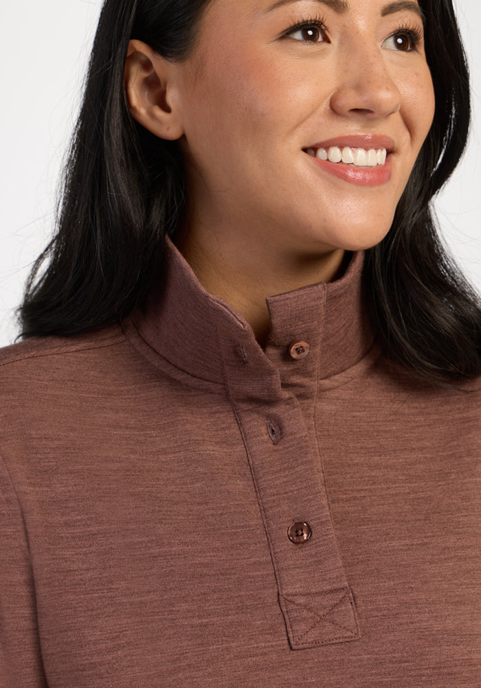 Woman smiling in the Woolx Annie 3 Button Pullover in Sable Heather, shown from the shoulders up.