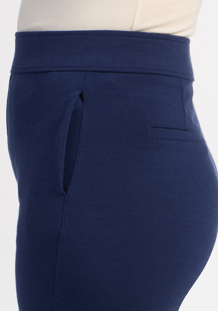 Model in Woolx Emerson Straight Leg Pants - Ocean Cavern with side pocket, paired with a white top, waist down.