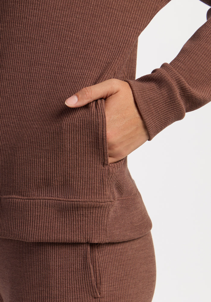 Someone in a Woolx Quinn Ribbed 1/4 Zip - Sable Heather has their hand in a front pocket.