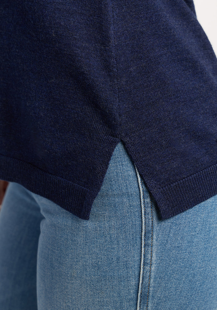 Close-up of the Woolx Josie Cowl Neck Sweater in Ocean Cavern, styled over light blue jeans.