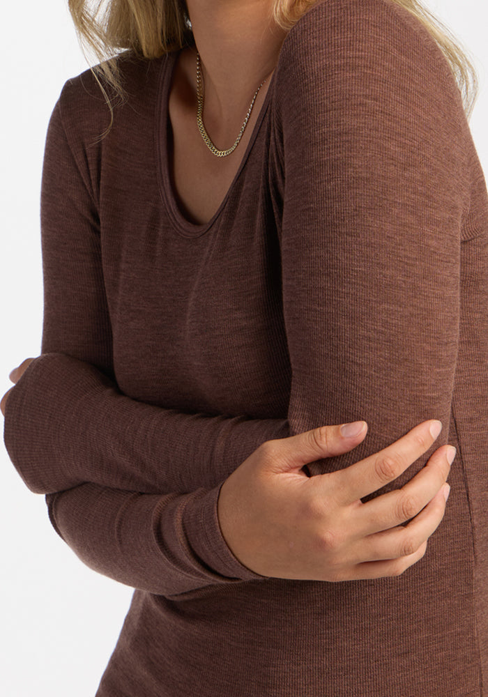 Person in Woolx Katie Ribbed Long Sleeve in Sable Heather, gold chain necklace, arms crossed; white background.