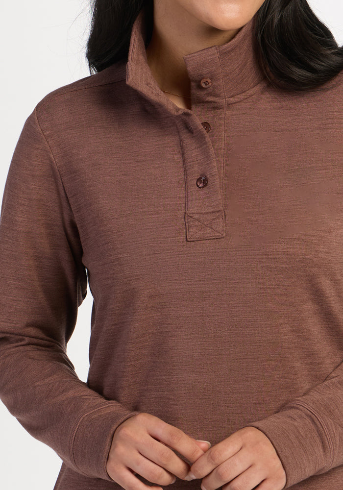 Model in Woolx Annie 3 Button Pullover - Sable Heather; hands gently clasped, head not shown.