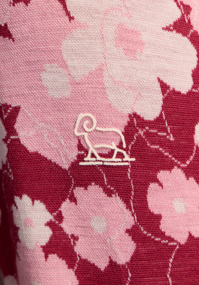 Woolx Maddie Baselayer Top - Floral Crush: pink/red floral women’s top with small white ram logo at center.