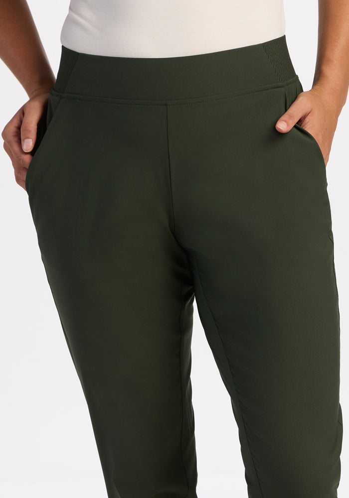 Model wears Woolx Palmer Joggers - Duffel Bag, hands in pockets, waist to mid-thigh view on white background.