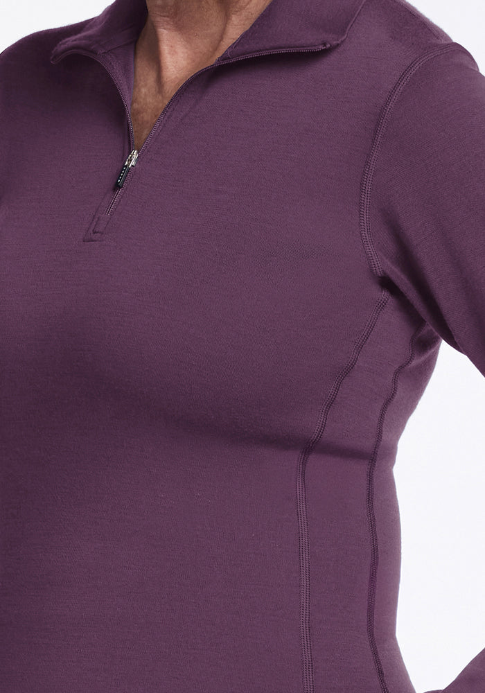 Model in Woolx Brooke 1/4 Zip - Purple Iris, long sleeve, shown neck to waist on white background.
