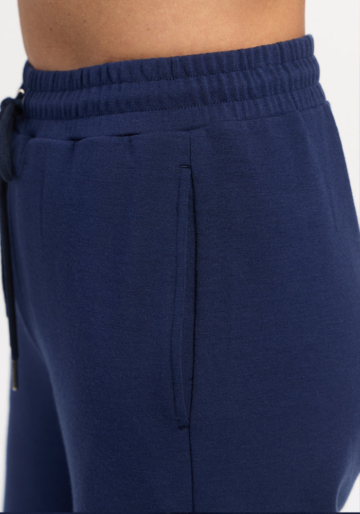 Close-up of Woolx Eloise Wide Leg Pants - Ocean Cavern, relaxed fit and elastic waist, shown hip down.