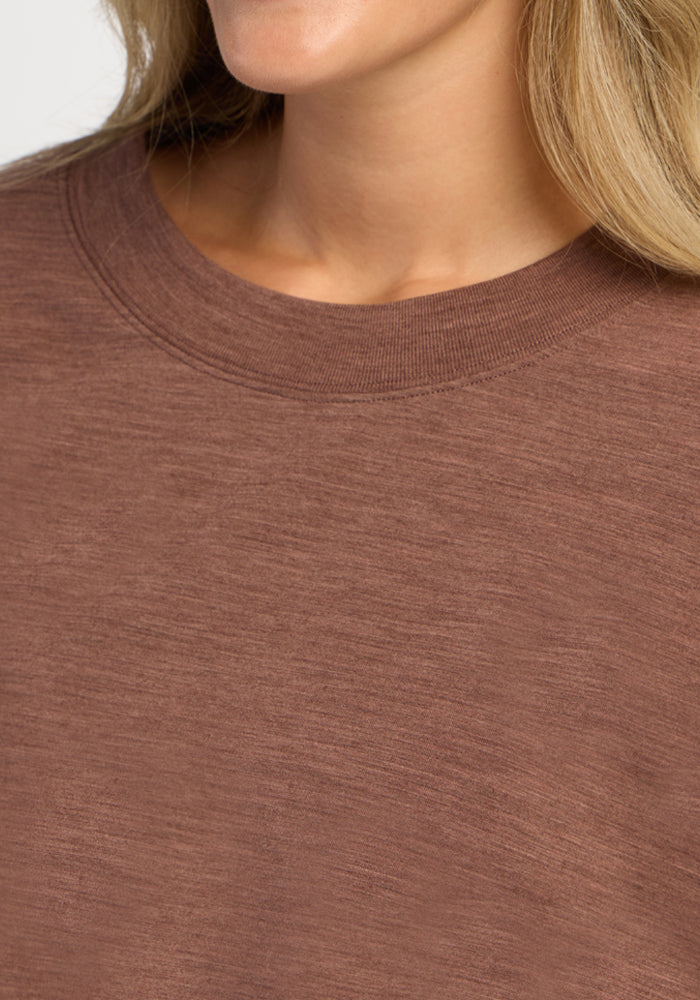 Close-up of a brown moisture-wicking Molly Crewneck - Sable Heather merino wool shirt.