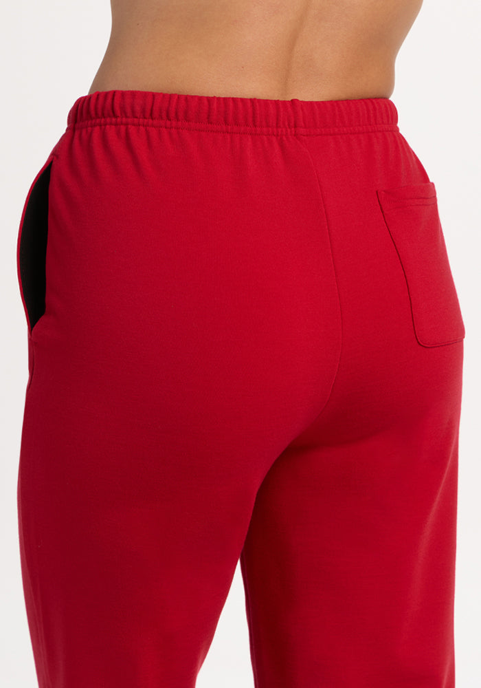 Model in Woolx Juliette Joggers - Maraschino Cherry, showing back pocket and waistband.