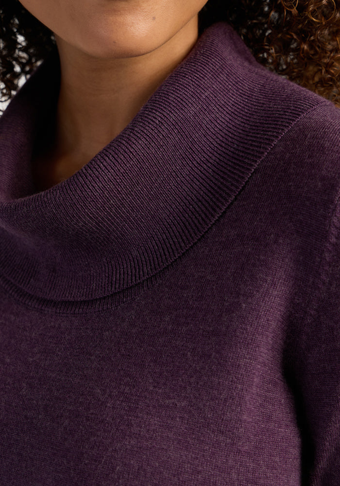 Close-up of a woman in the Woolx Josie Cowl Neck Sweater in Purple Iris, featuring the collar and her face.