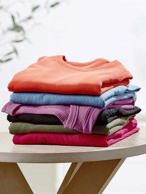 Stack of assorted color ribbed tank tops
