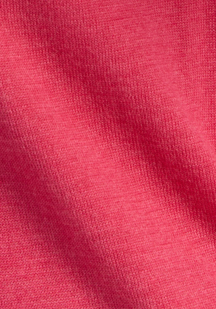 Close-up of Woolx Caitlin Sweater in Vivid Rose, showing soft Merino wool with ribbed texture and visible weave.