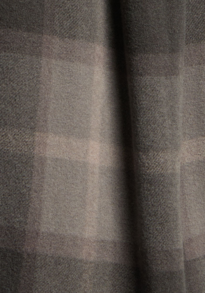 Close-up of Woolx Sawyer Shacket in Volcanic Ash Plaid, showing its soft merino wool and subtle brown-gray stripes.