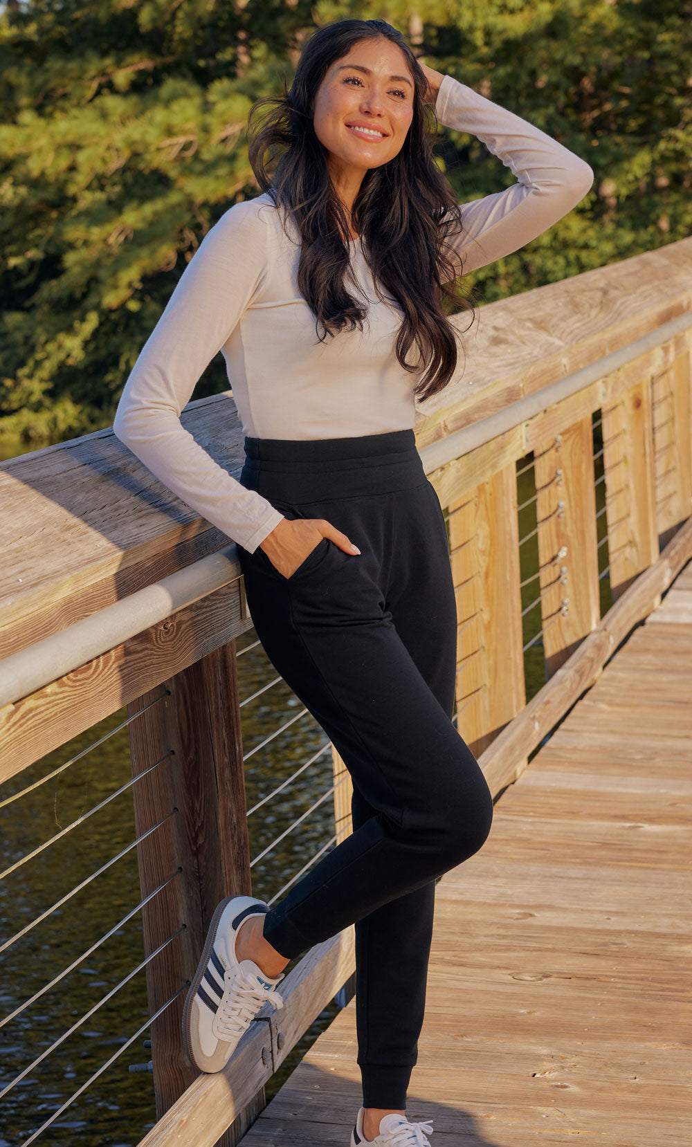 Model wearing Sophia and Willa joggers on bridge