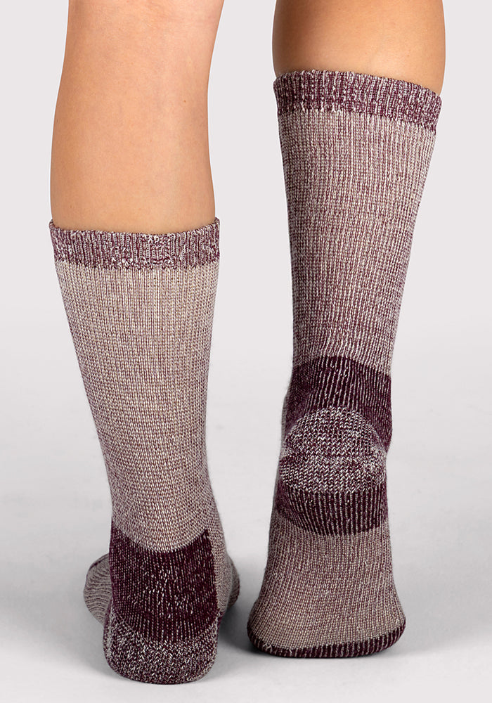 A person shown from the back wears Woolx Womens Extreme Crew Socks in Windsor Wine, knee-high and thick, against a plain light background.