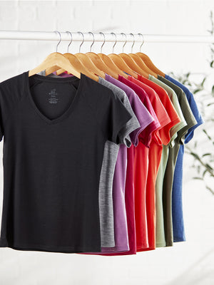 Different color Mia tee shirts hanging on clothing rack