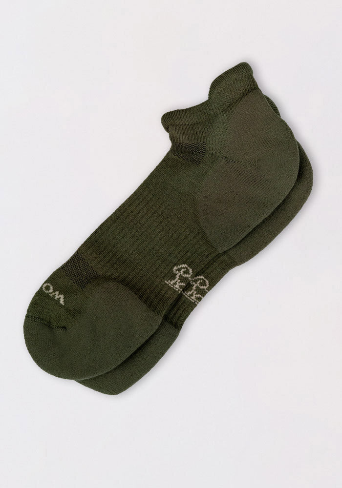 A pair of Woolx Mens Rowan No Show Socks in Winter Moss, featuring a ribbed texture and subtle white logo, laid flat on a light background.