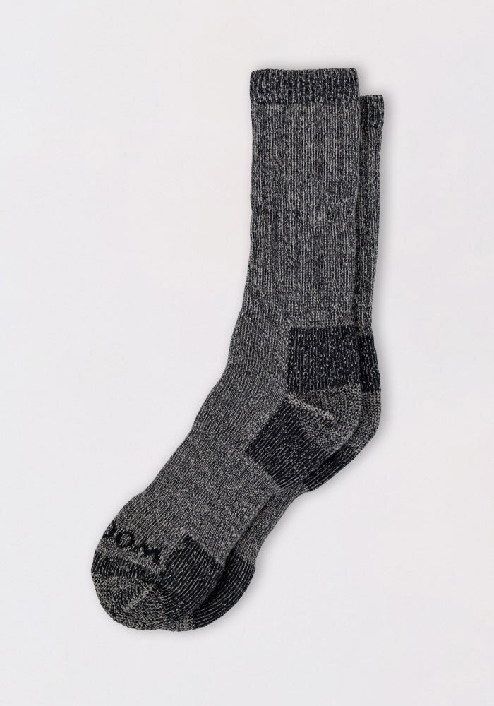 The Woolx Mens Extreme Crew Socks in Charcoal Heather are heavyweight merino wool socks with darker gray accents—ideal for keeping feet warm all winter.