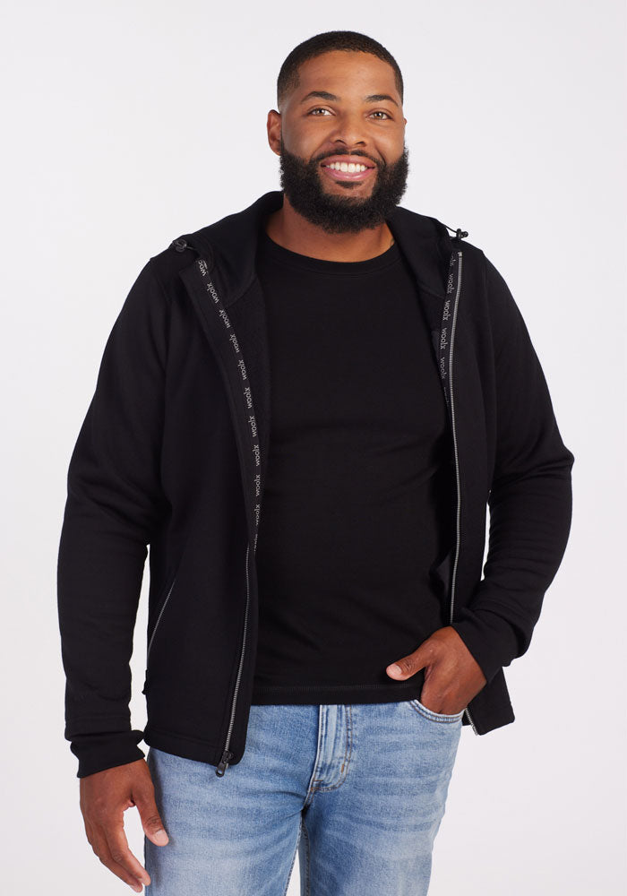 Model wearing Grizzly hoodie with silver zipper - Black | Terrence is 6’3”, wearing a size L