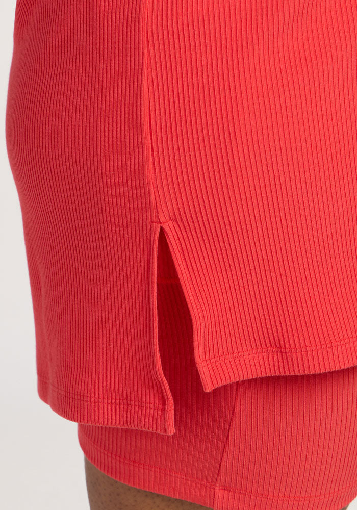 Close-up of Woolx Vera Ribbed Tunic in Hibiscus, featuring a side slit on the tunic-length top.