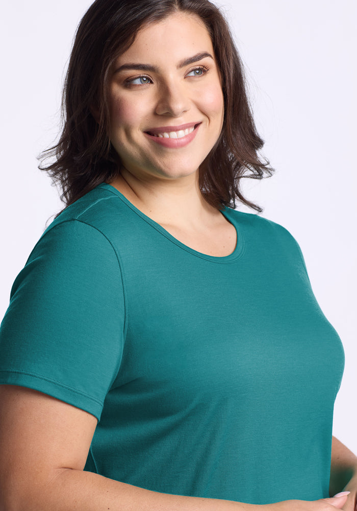 A woman in the Woolx Liza Crew Neck Tee in Surfside.