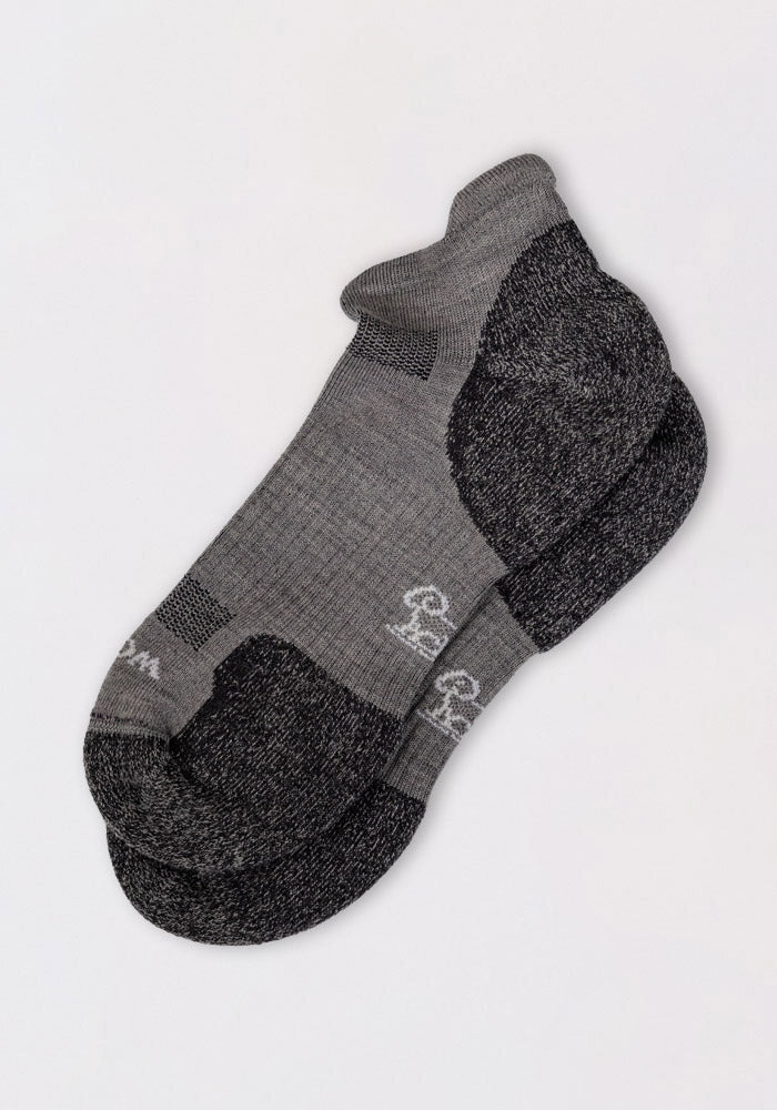 Woolx Womens Rowan No Show Socks in grey feature cushioned, ankle-length design with a small white logo near the toes, shown overlapping on a plain light background.