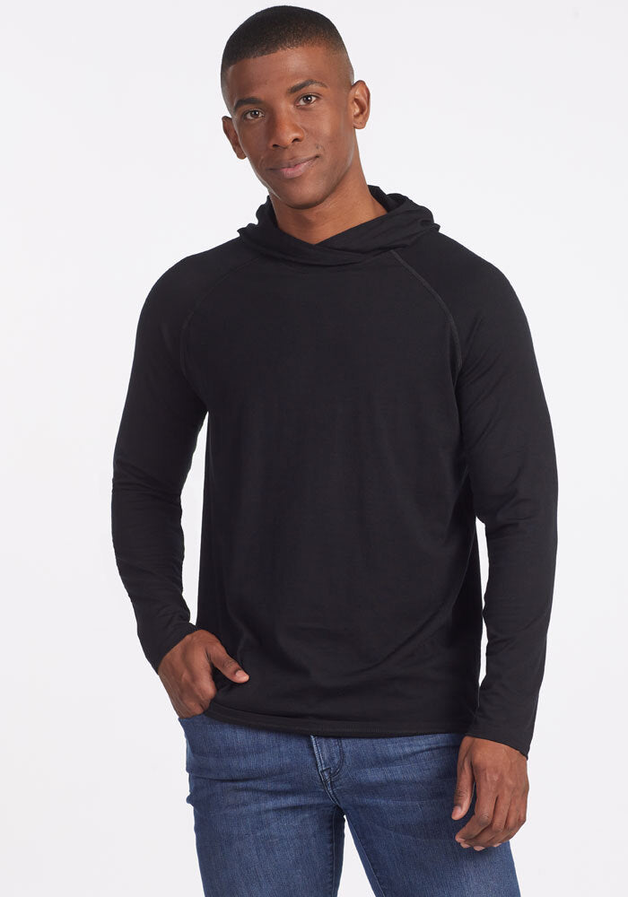 Model wearing base camp hoodie - black | Trell is 6'2", wearing a size M