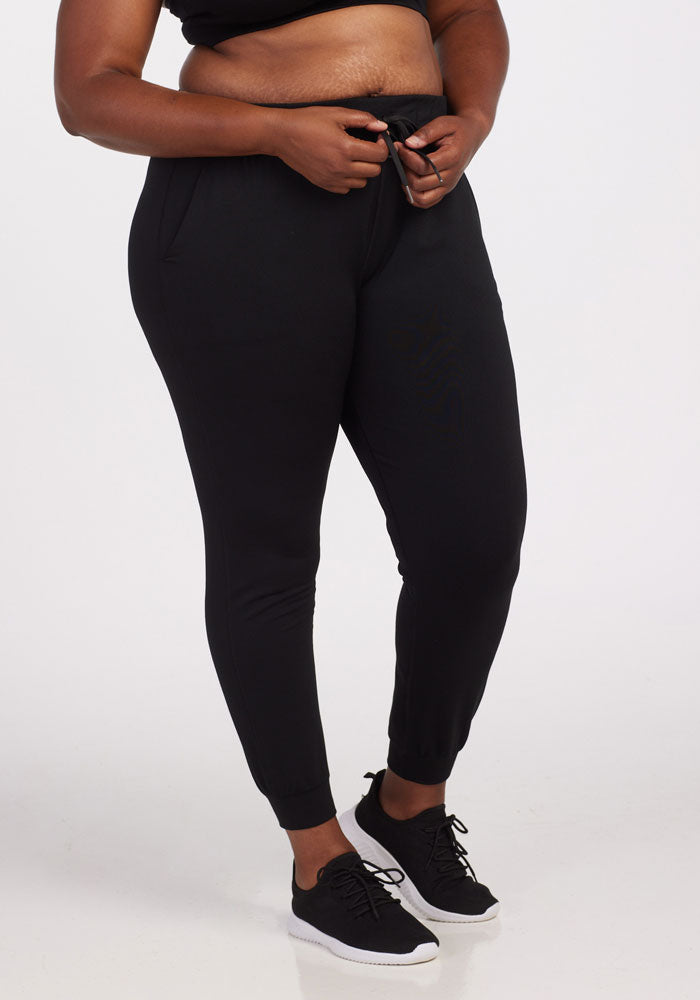 womens warm joggers - black | Le'Quita is 5'11", wearing a size XL