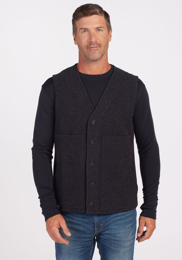 Mens merino wool button vest - Carbon Black | Lee is 6', wearing a size M